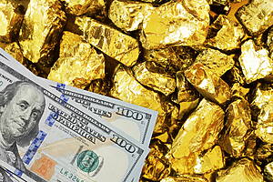 Hundred dollar banknotes on gold mine